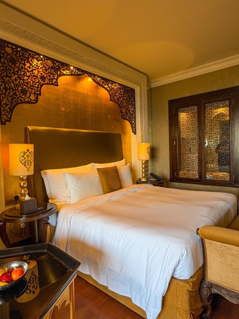 Neatly made hotel bed with crisp white linen